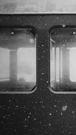 "Stunning black and white monochrome capture of a train window viewed from an iPhone"