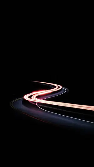Illuminated Black iPhone Displaying Time-Lapse of Moving Car