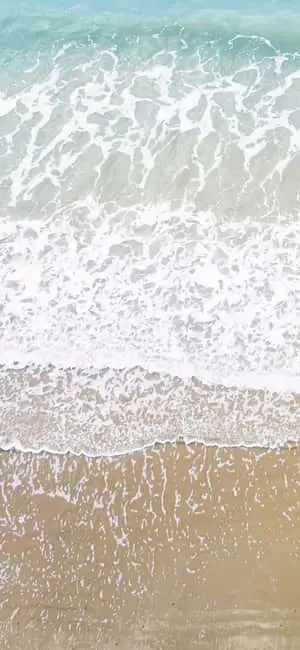 Captivating iPhone X wallpaper capturing an exhilarating beach format
