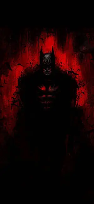 The Dark Knight illuminates the night with an eerie red glow on a sleek iPhone.