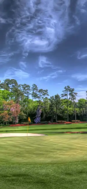 A golfer enjoying a beautiful afternoon on the fairway