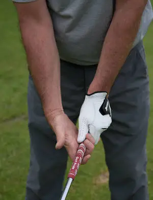 Man Holding A Club Golf Phone