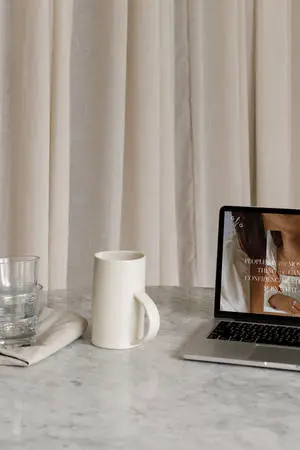 Minimalist Coffee And Laptop On Marble