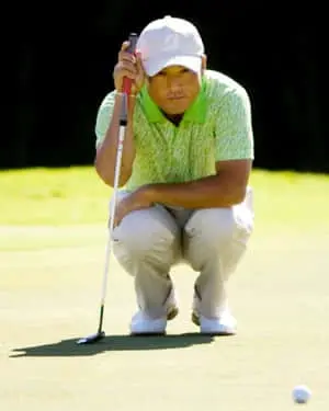 Shigeki Maruyama Squatting Before A Put